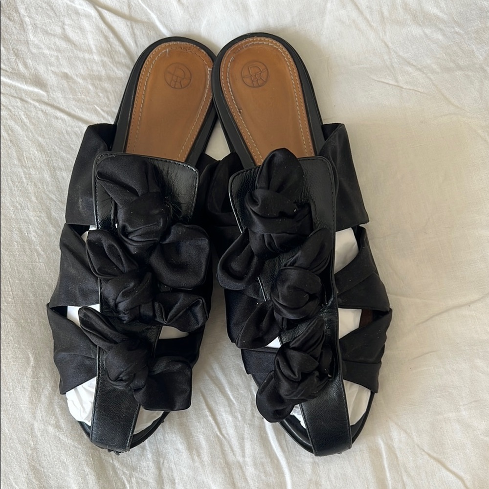 The Row Black Flats & Loafers with Woven Patent Straps